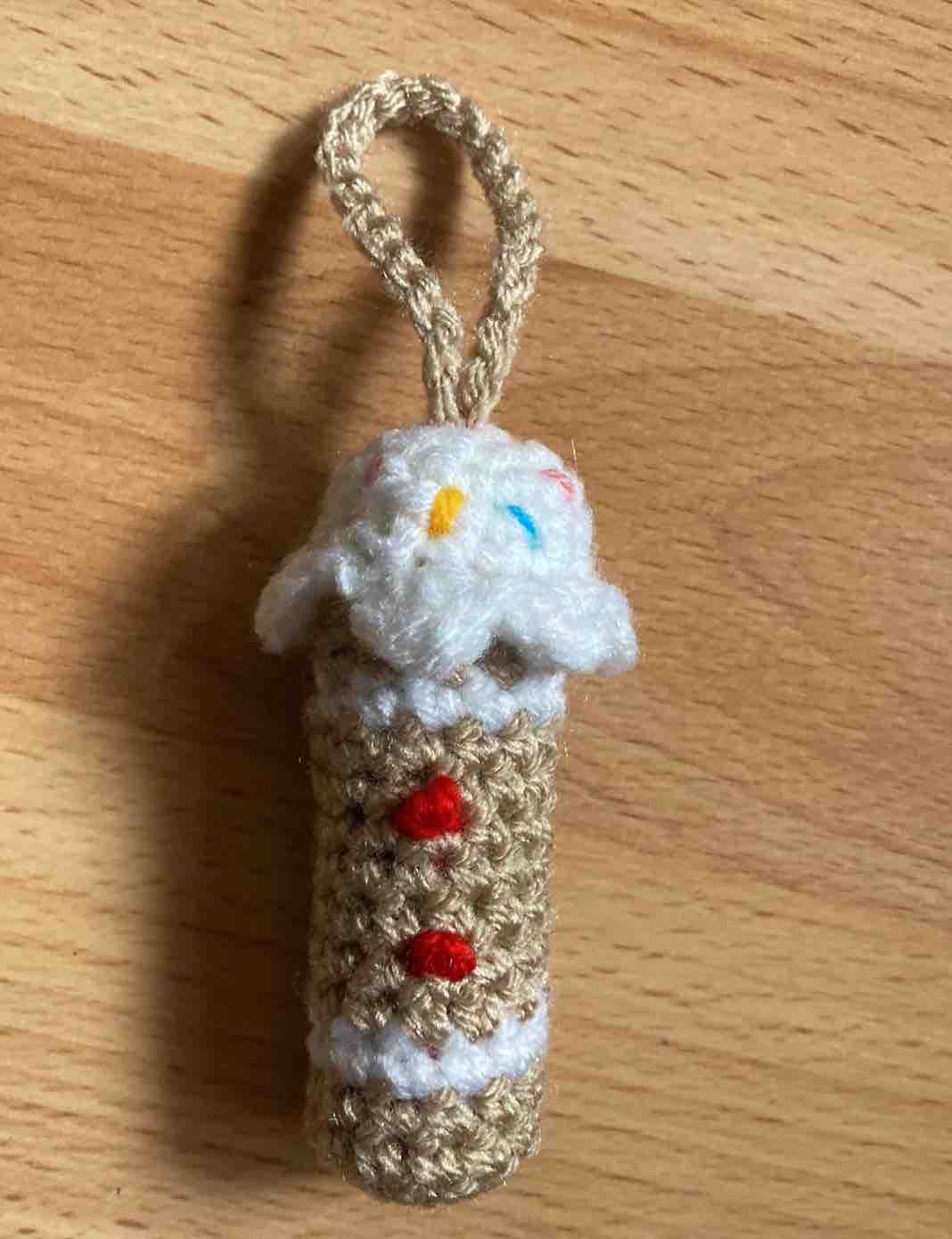Crochet Gingerbread Man Lip Balm Cozy with sprinkles