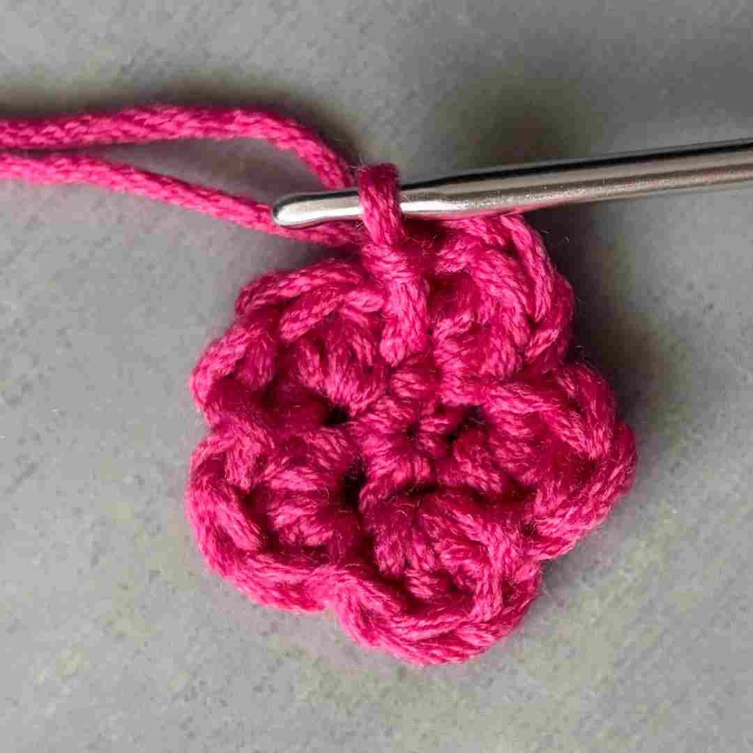 Small flower crochet applique in pink