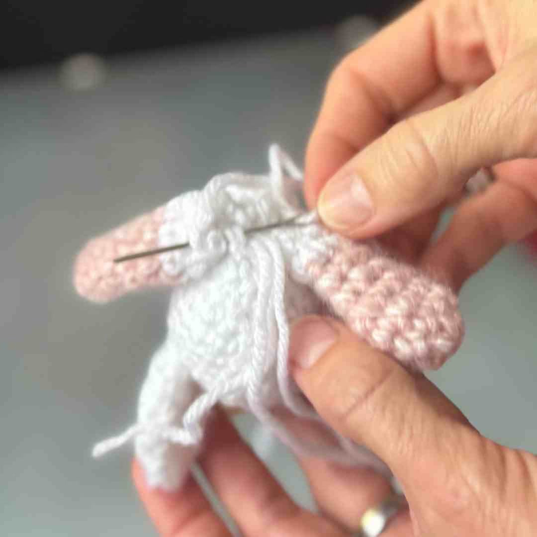 Unicorn Lovey attach arms to bottom of head