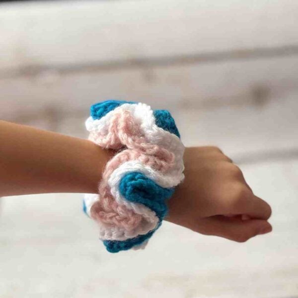 ruffle crochet scrunchie worn on wrist