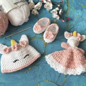 crocheted baby unicorn hat, unicorn lovey and baby booties